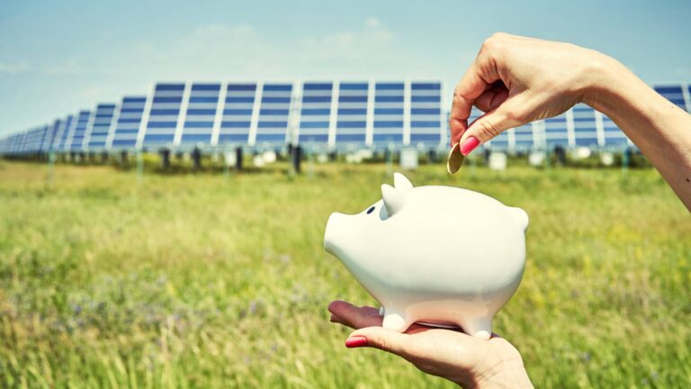 piggy bank coins on solar panels Why Are My Solar Panels Not Saving Me Money
